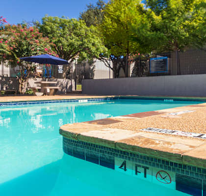 A swimming pool with a 4 ft marking on the side.