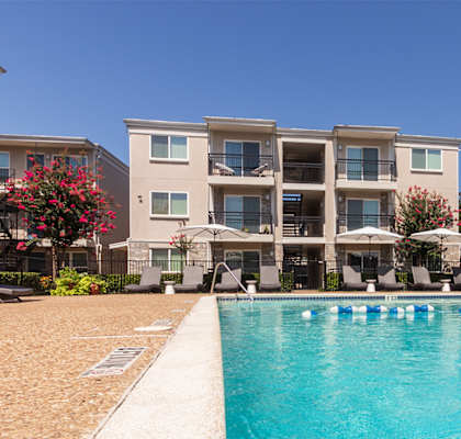 This is a photo of the pool area at The Summit at Midtown Apartments in Dallas, TX.