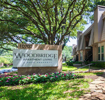 The Sign for Woodbridge Apartments at Woodbridge Apartments in Midtown, Dallas, TX.
