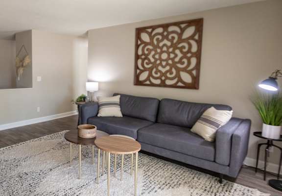 This is picture of the living room and dining area in the 823 square foot 2 bedroom apartment at Aspen Village Apartments in the Westwood neighborhood of Cincinnati, OH.