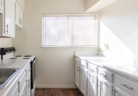 This is a photo of the kitchen in the 899 square foot, 2 bedroom, 1.5 bath apartment at Blue Grass Manor Apartments in Erlanger, KY.