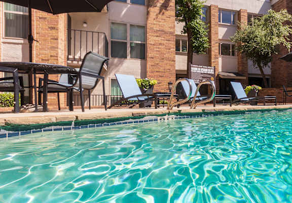This is a photo of the primary pool area at Cambridge Court Apartments in Dallas, TX.