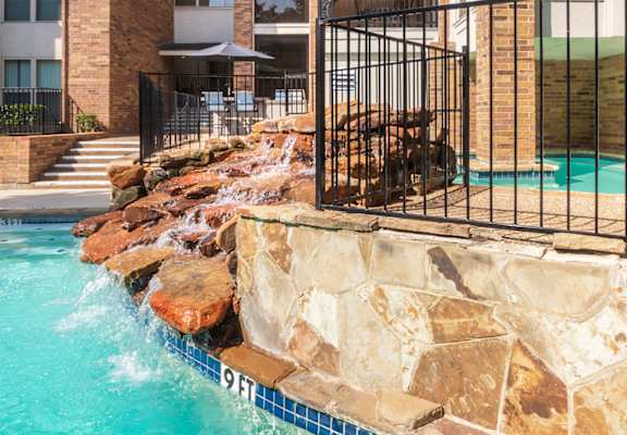 This is a photo of the primary pool area at Cambridge Court Apartments in Dallas, TX.