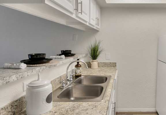 This is a photo of the kitchen in the 477 square foot 1 bedroom apartment at Canyon Creek Apartments in Dallas, TX.