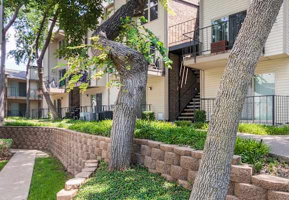 This is a photo of building exteriors/grounds at Canyon Creek Apartments in Dallas, TX.