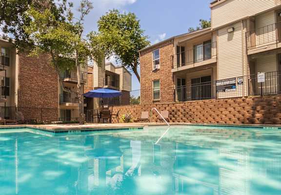 This is a photo of the pool area at Canyon Creek Apartments in Dallas, TX.