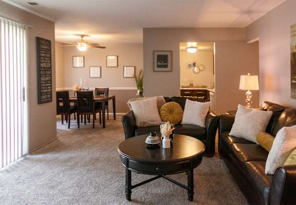 This is a picture of the living room in the 980 square foot, 2 bedroom, 1 bath model apartment at Fairfield Pointe Apartments in Fairfield, Ohio.