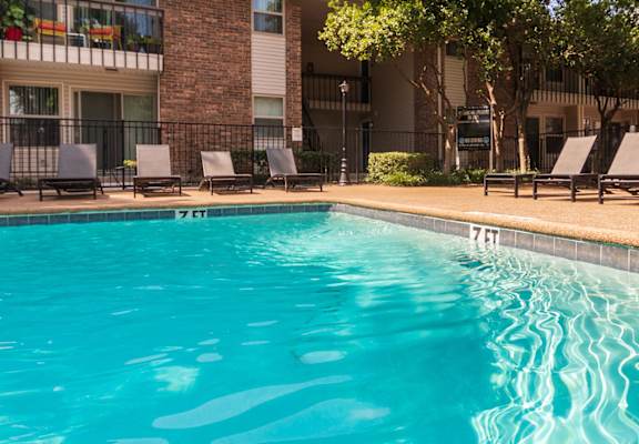 This is a photo of the pool area at Preston Park Apartments in Dallas, TX
