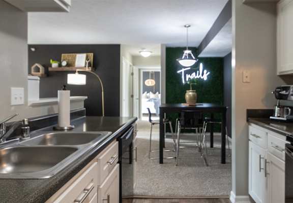 This is a photo of the dining room from the  kitchen in the 1226 square foot 3 bedroom, 2 bath Hambletonian at Trails of Saddlebrook Apartments in Florence, KY.