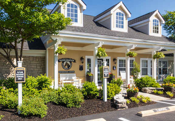 A house with a sign in front of it.
