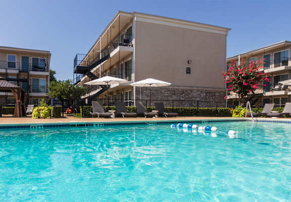 This is a photo of the pool area at The Summit at Midtown Apartments in Dallas, TX.