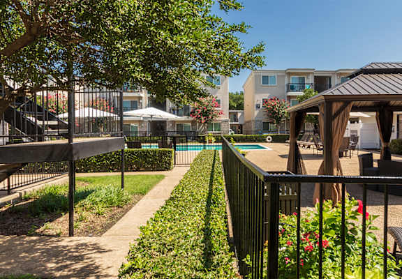 This is a photo of the pool area at The Summit at Midtown Apartments in Dallas, TX.