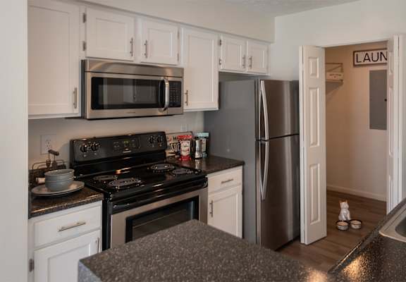 This is a photo of the kitchen of the 1100 square foot 2 bedroom Kettering floor plan at Washington Park Apartments in Centerville, OH.