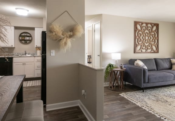 This is picture of the Kitchen and living room from the entryway in the 823 square foot 2 bedroom apartment at Aspen Village Apartments in the Westwood neighborhood of Cincinnati, OH.