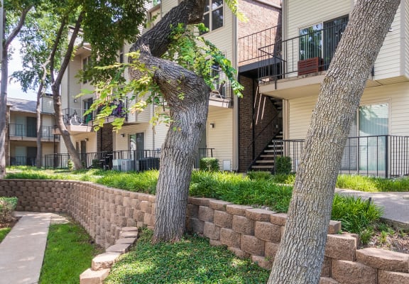 This is a photo of building exteriors/grounds at Canyon Creek Apartments in Dallas, TX.