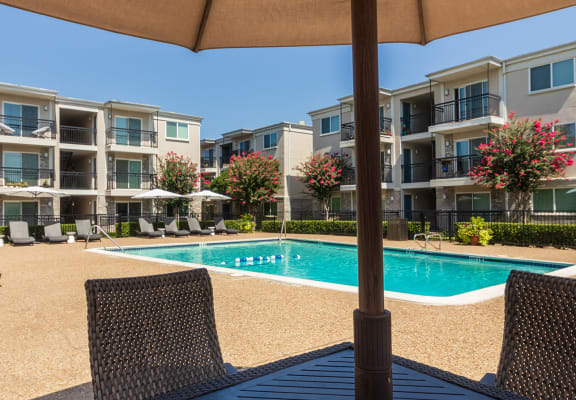 This is a photo of the pool area at The Summit at Midtown Apartments in Dallas, TX.