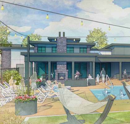 A modern house with a pool and lounge chairs.
