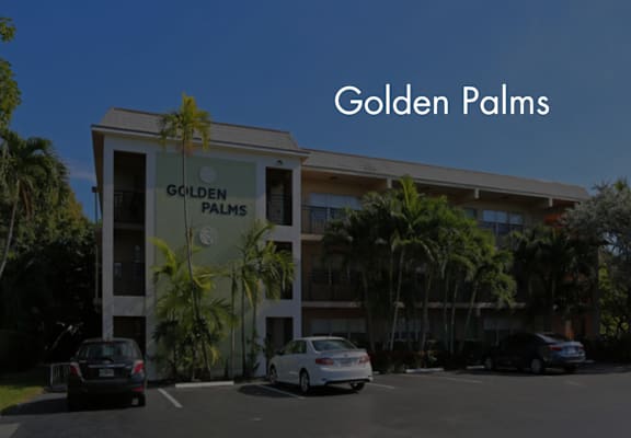 a building with the words golden palms in front of it