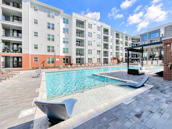 Saltwater pool with swim lane, sun shelves, cabanas and bubblers