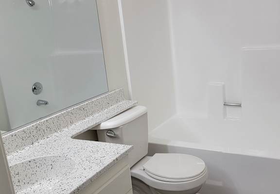 a bathroom with a toilet sink and bathtub