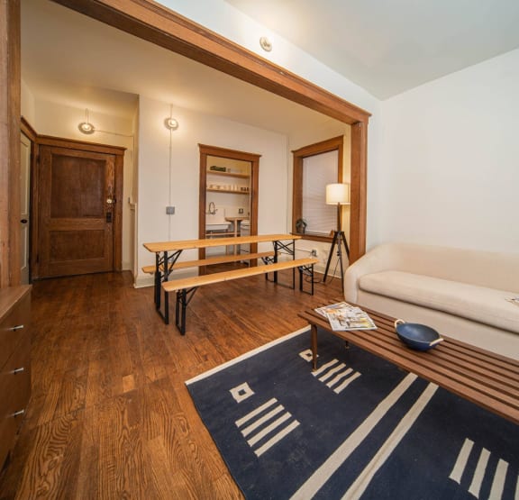 a bedroom with a bed and bookshelves     and a chair