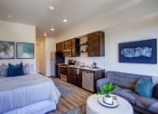 Thumbnail 6 of 31 - Living and cozy bed at Commons at Sylvan Canyon Apartments, Portland, Oregon