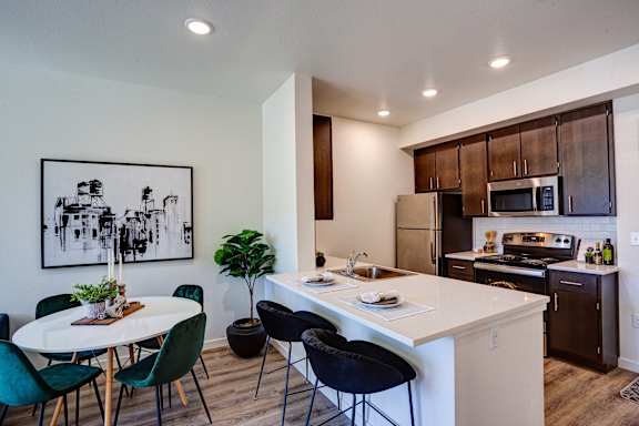 Kitchen with counter at Commons at Sylvan Canyon Apartments, Portland, 97221