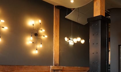 a view of a lobby with a staircase and lights  at The Cordovan at Haverhill Station, Haverhill, Massachusetts