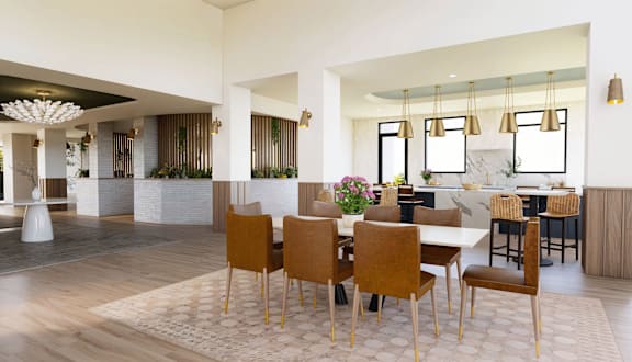 a kitchen and dining room with a table and chairs