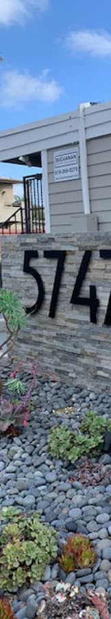 a sign that is on the side of a building