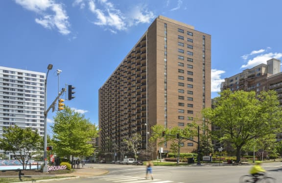 a tall building on the corner of a city street