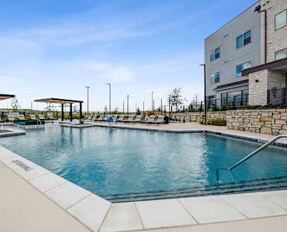 the swimming pool at the preserve at city center apartments