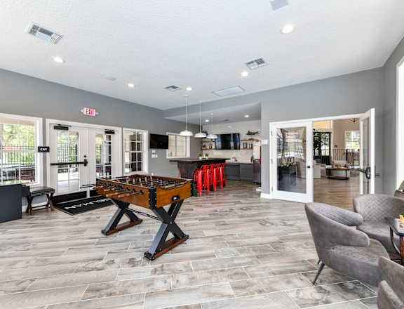 Lounge and Game Room with Mrs. Pac Man and Sand Shuffle Board at Paradise Island Apartments, Jacksonville, FL 32256