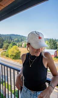a woman standing on a balcony looking down at the groundat Scouter's Mountain, Happy Valley, OR 97086