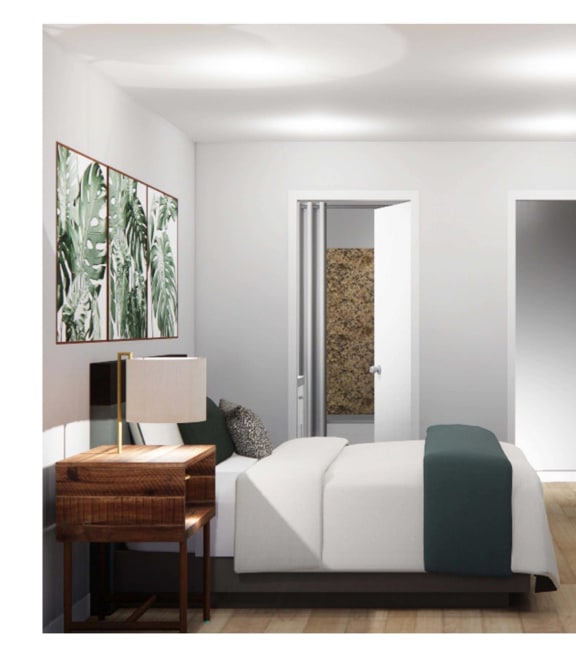 a bedroom with a bed and a desk