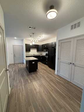 a renovated living room and kitchen in a new home