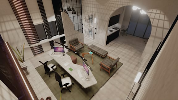 an overhead view of a office space with a desk and chairs