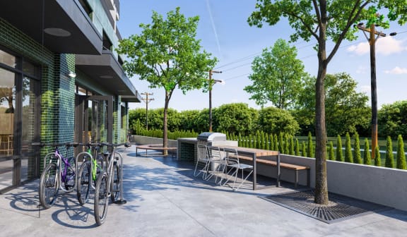 A patio with a table and chairs and bicycles.