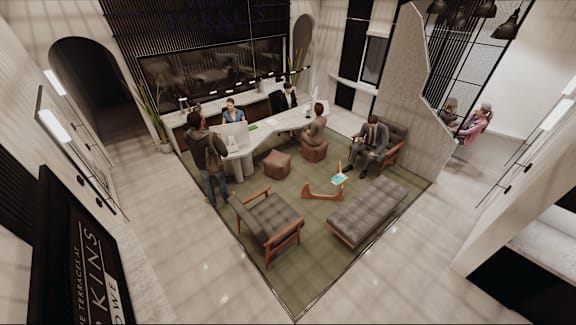 an aerial view of a living room with people sitting around a table