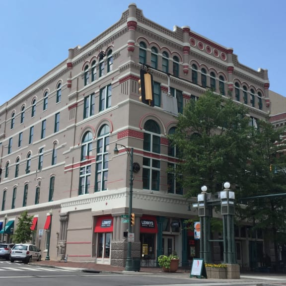a large building on the corner of a city street