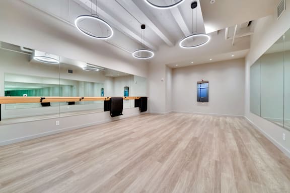 A room with wooden floors and a glass wall.