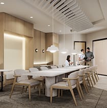A conference room with a long table and chairs.