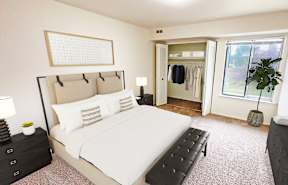 A bedroom with a large bed and a window.