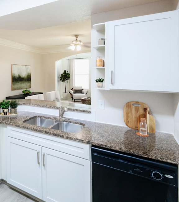 Dining room with table and comfortable chairs at The Fenwick Apartment Homes, Humble, 77396