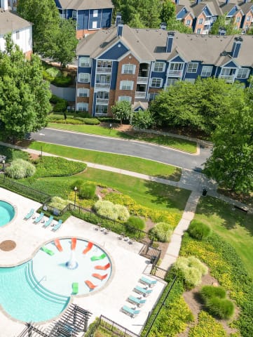 The Crest at Sugarloaf Pet Friendly Apartment Community Aerial View of Resort Style Pool Lawrenceville, GA