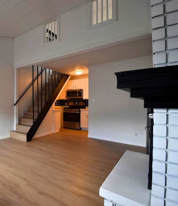 A room with a staircase leading to the upper floor.