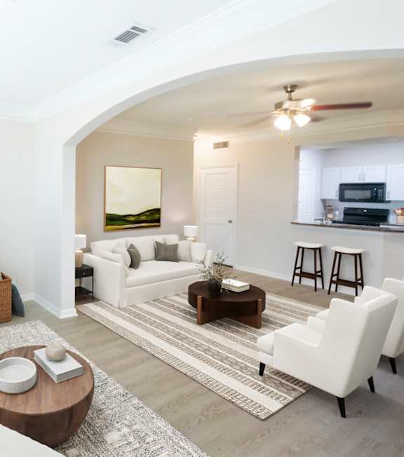 Pool side patio with chairs and tables at The Fenwick Apartment Homes, Humble, TX, 77396