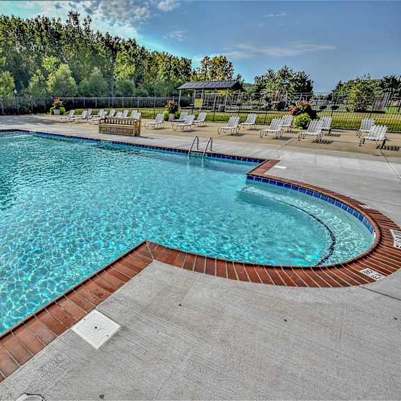 A large outdoor swimming pool at Evergreen Luxury Apartments, Merrillville, IN