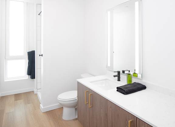 a bathroom with a sink and a toilet and a shower at The Weidler in Portland, OR 97209