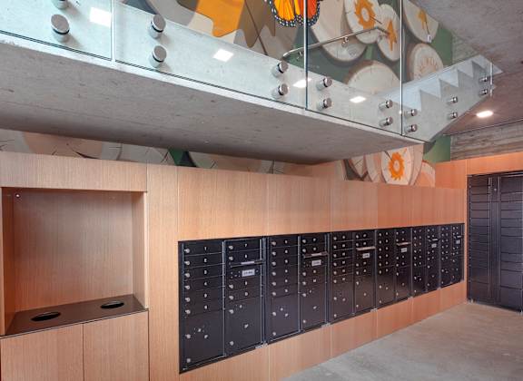 View of the lockers in a room with a painting on the wall at The Weidler in Portland, OR 97209